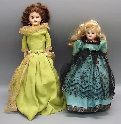 Appraisal: Pair of shoulderhead dolls doll with stationary brown eyes CLOSED