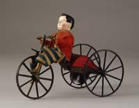 Appraisal: EARLY STEVEN S BOY RIDING VELOCIPEDE Great early toy with