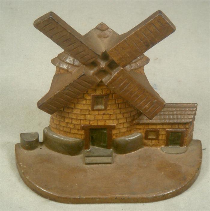 Appraisal: Cast iron doorstop brown windmill on base engraved on back