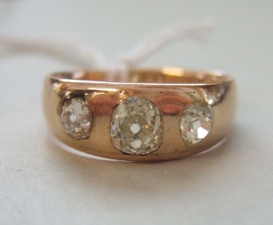 Appraisal: A gold and diamond set three stone ring mounted with