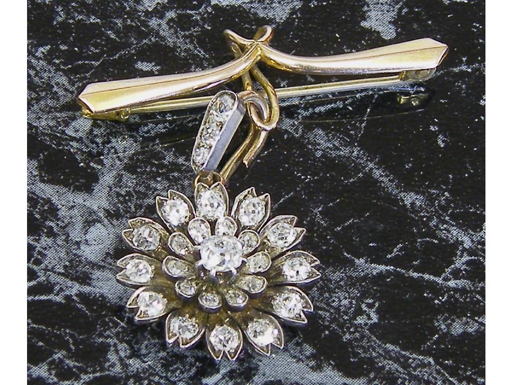 Appraisal: Attractive diamond floral pendant with a central diamond with a