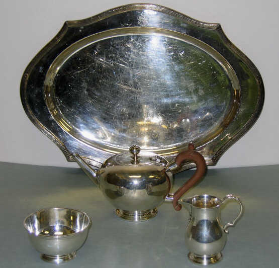 Appraisal: THREE-PIECE SILVER TEA SET AND TRAY Comprising EJG London silver