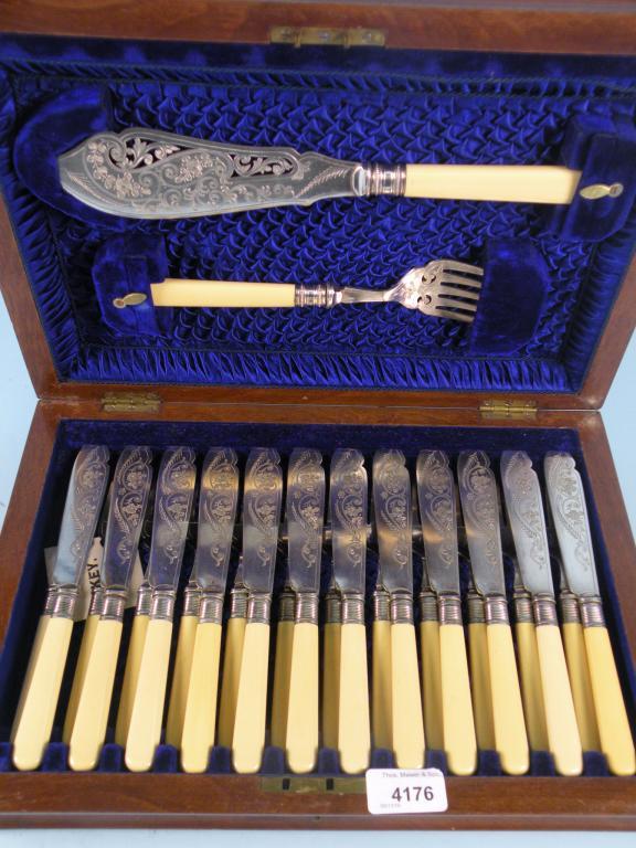 Appraisal: A set of twelve silver plated fish knives and forks