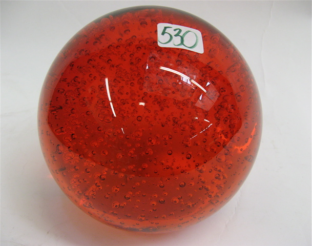 Appraisal: LARGE CANDY APPLE RED GLASS PAPERWEIGHT with bubbles suspended in