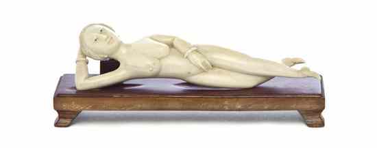 Appraisal: A Chinese Ivory Doctor's Model of typical form atop a