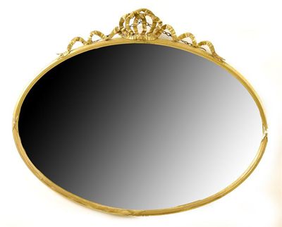 Appraisal: An Edwardian giltwood and gesso oval wall mirror with a