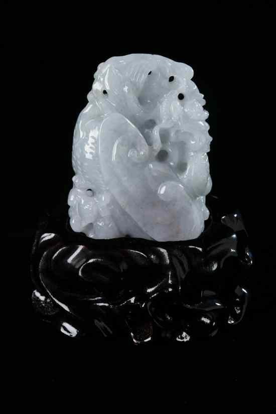 Appraisal: CHINESE LIGHT GREY JADEITE FIGURE OF DRAGON Carved with ruyi