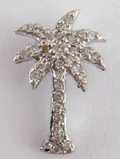 Appraisal: A white metal tests carat gold diamond pendant designed as