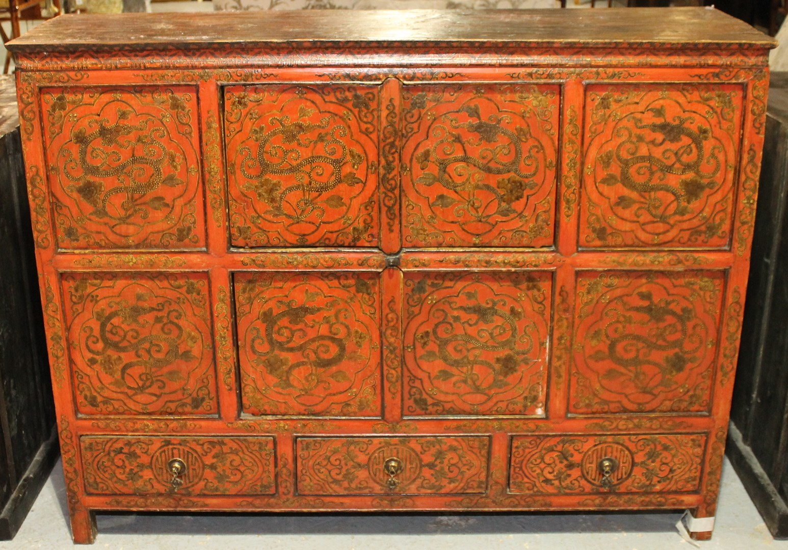 Appraisal: A th century Eastern red lacquer side cabinet with two