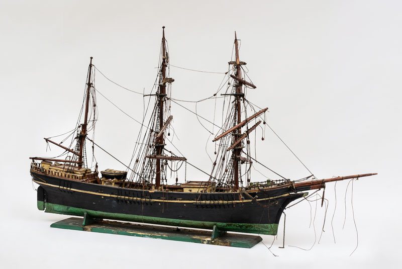 Appraisal: PAINTED WOOD AND METAL THREE-MASTED SHIP MODEL Raised on a