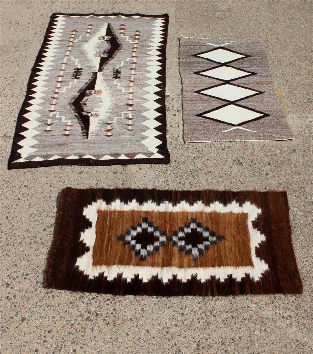 Appraisal: TWO NAVAJO WOOL RUGS TOGETHER WITH A PERUVIAN ALPACA RUG