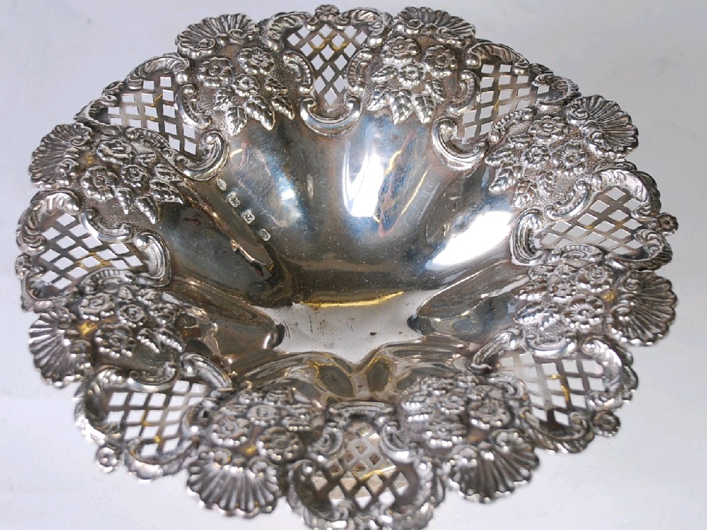 Appraisal: LATE VICTORIAN SILVER PEDESTAL BOWL with rococo embossed and lattice