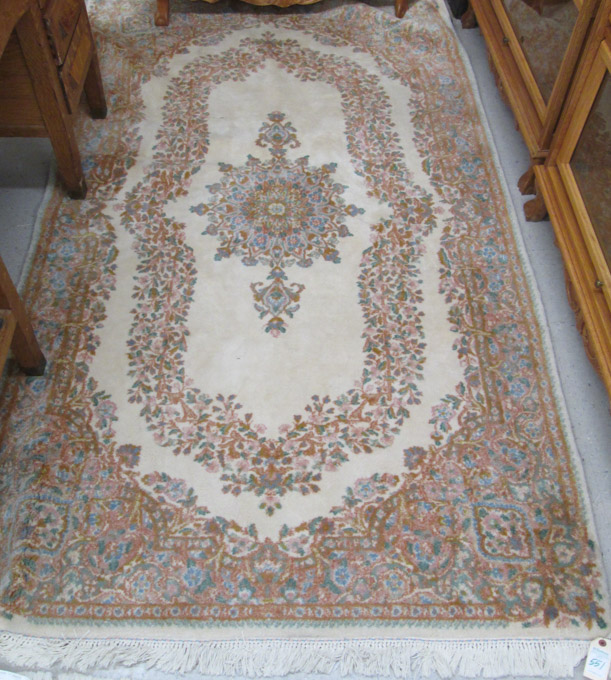 Appraisal: PERSIAN KERMAN CARPET hand knotted in a floral and central