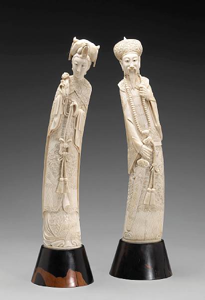 Appraisal: A pair of Chinese carved ivory standing figures of an