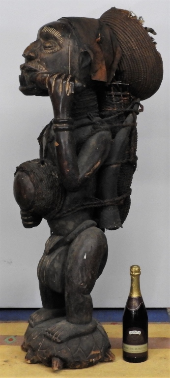 Appraisal: AFRICAN EFFIGY CARVED WOOD FIGURE ON TURTLE Africa th CenturyIvory