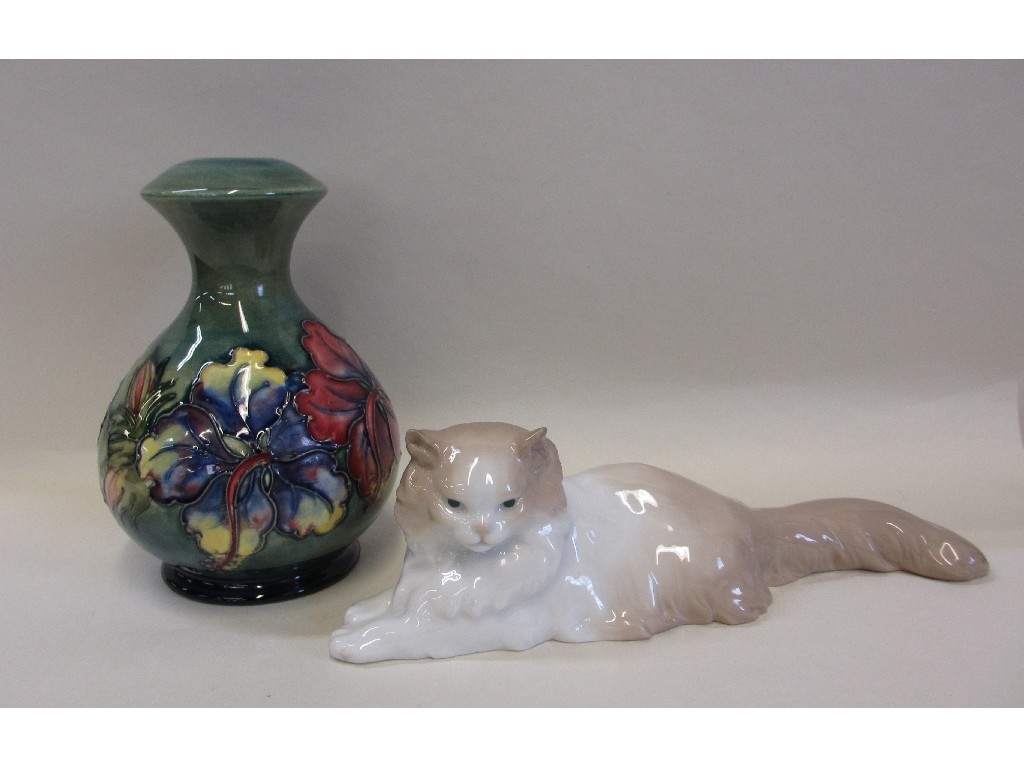 Appraisal: Moorcroft Hibiscus pattern lamp base and a Nao cat