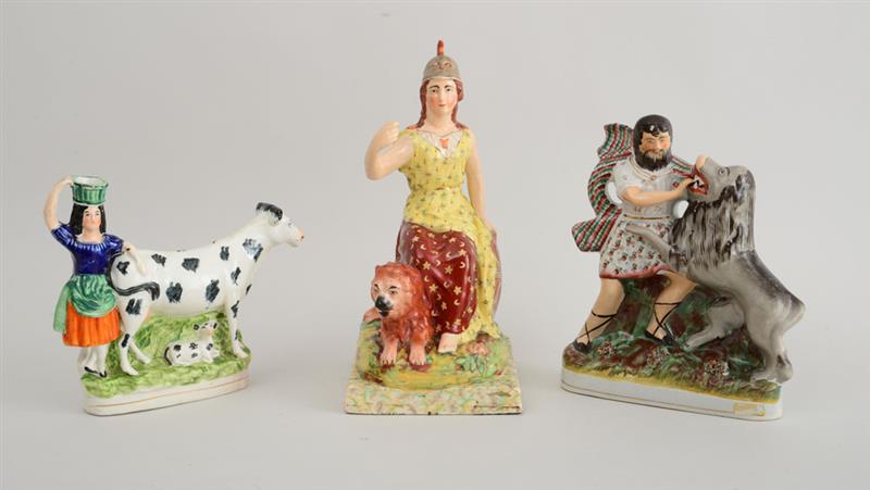 Appraisal: THREE STAFFORDSHIRE POTTERY FIGURE GROUPS Comprising the allegorical seated figure