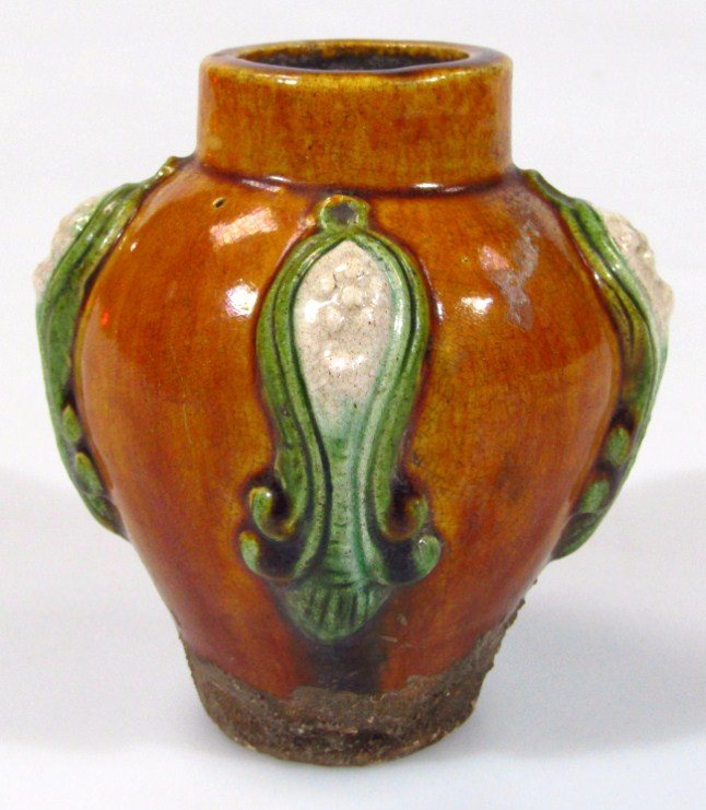 Appraisal: A Tang style vase with compressed circular top the shouldered