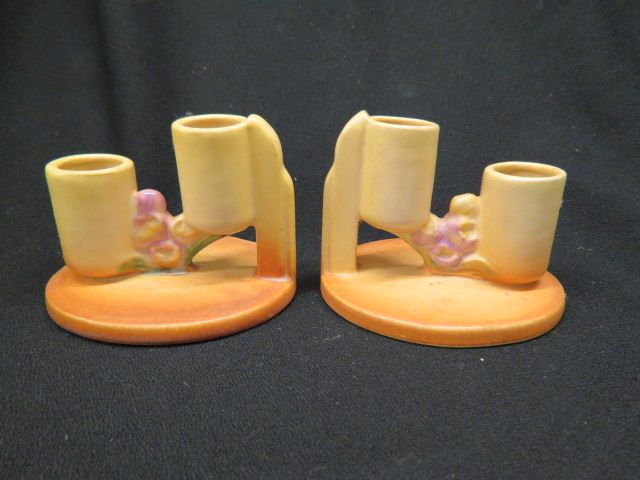 Appraisal: Roseville Pottery Ixia Candleholders double sconce yellow-brown 's tall excellent