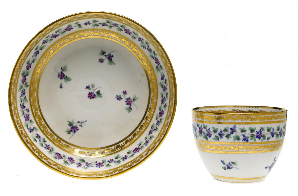 Appraisal: A DERBY TEACUP AND SAUCER of bute shape and enamelled