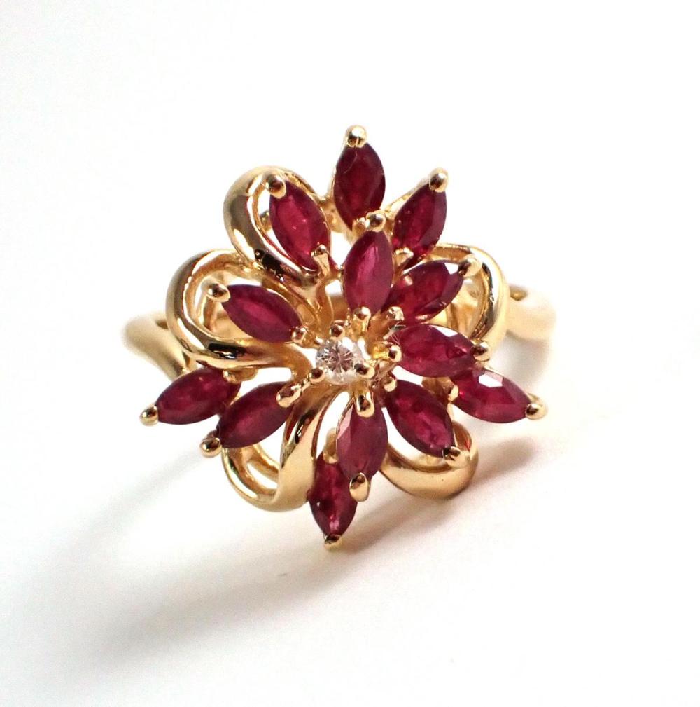 Appraisal: RUBY DIAMOND AND FOURTEEN KARAT CLUSTER RING with marquise-cut rubies