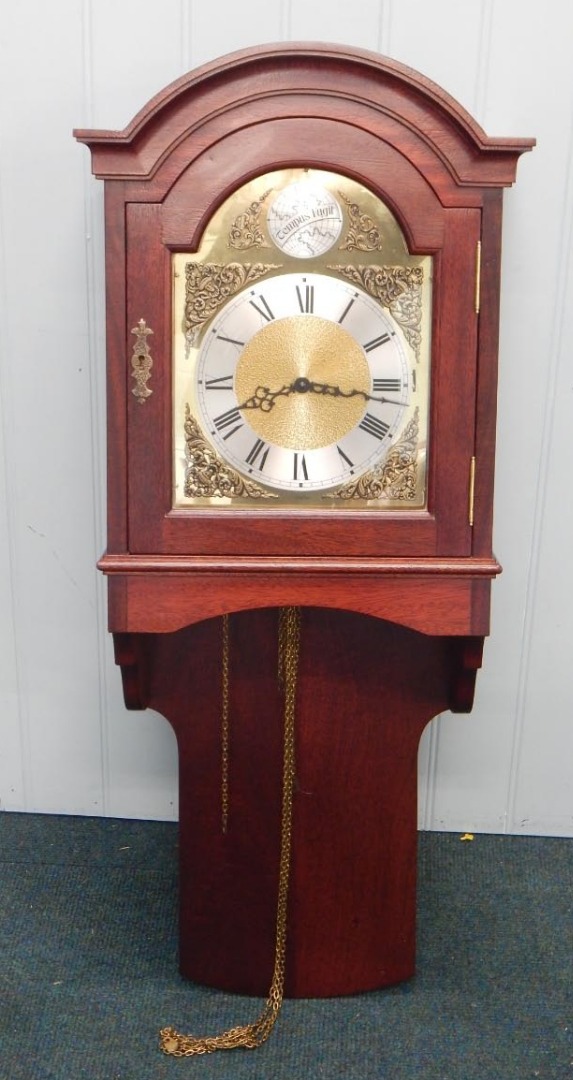 Appraisal: A modern reproduction wall clock the brass dial stamped Emperor