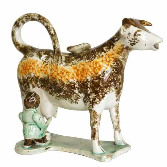 Appraisal: An English Staffordshire Pearlware Pottery Cow Milkmaid Creamer circa depicting