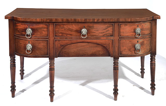 Appraisal: A REGENCY MAHOGANY BOW FRONTED SIDEBOARD with a rosewood cross