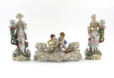 Appraisal: A pair of Continental porcelain candlestick figures modelled as a