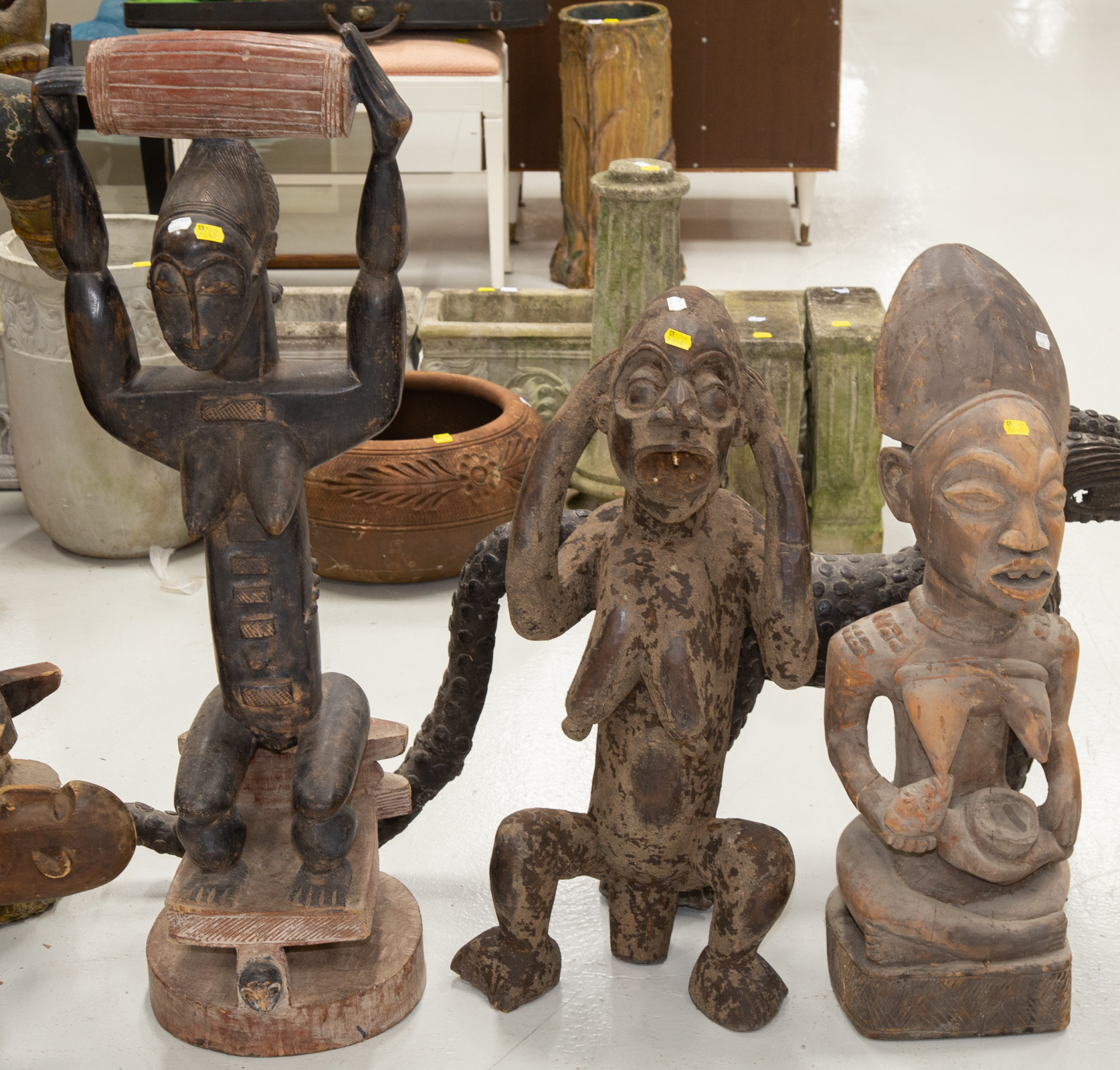 Appraisal: THREE PIECES OF AFRICAN SCULPTURE Including a Knogo style figure