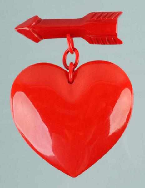 Appraisal: Rare Vintage Bakelite Heart with Arrow Pin Description s Celluloid