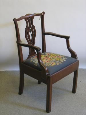 Appraisal: A GEORGE III MAHOGANY ELBOW CHAIR the waved top rail