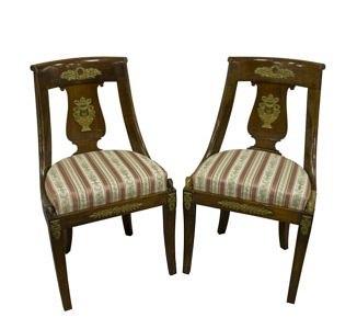 Appraisal: A pair of French Empire chairs each with curved broad