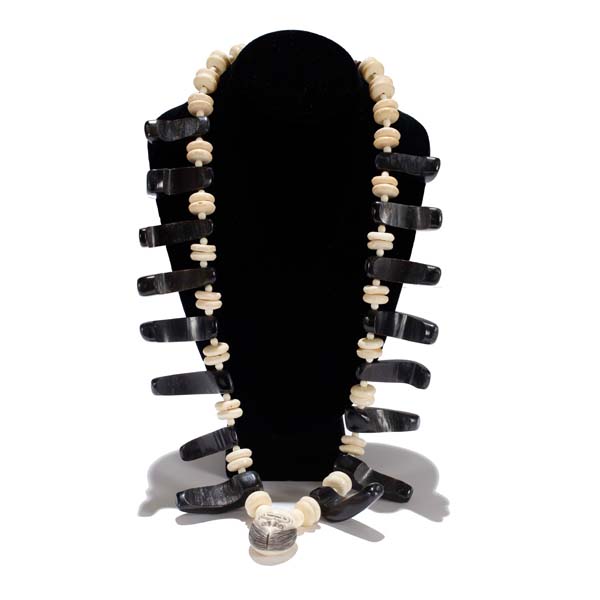 Appraisal: Bone and horn beaded necklace with ivory Japanese netsuke carving