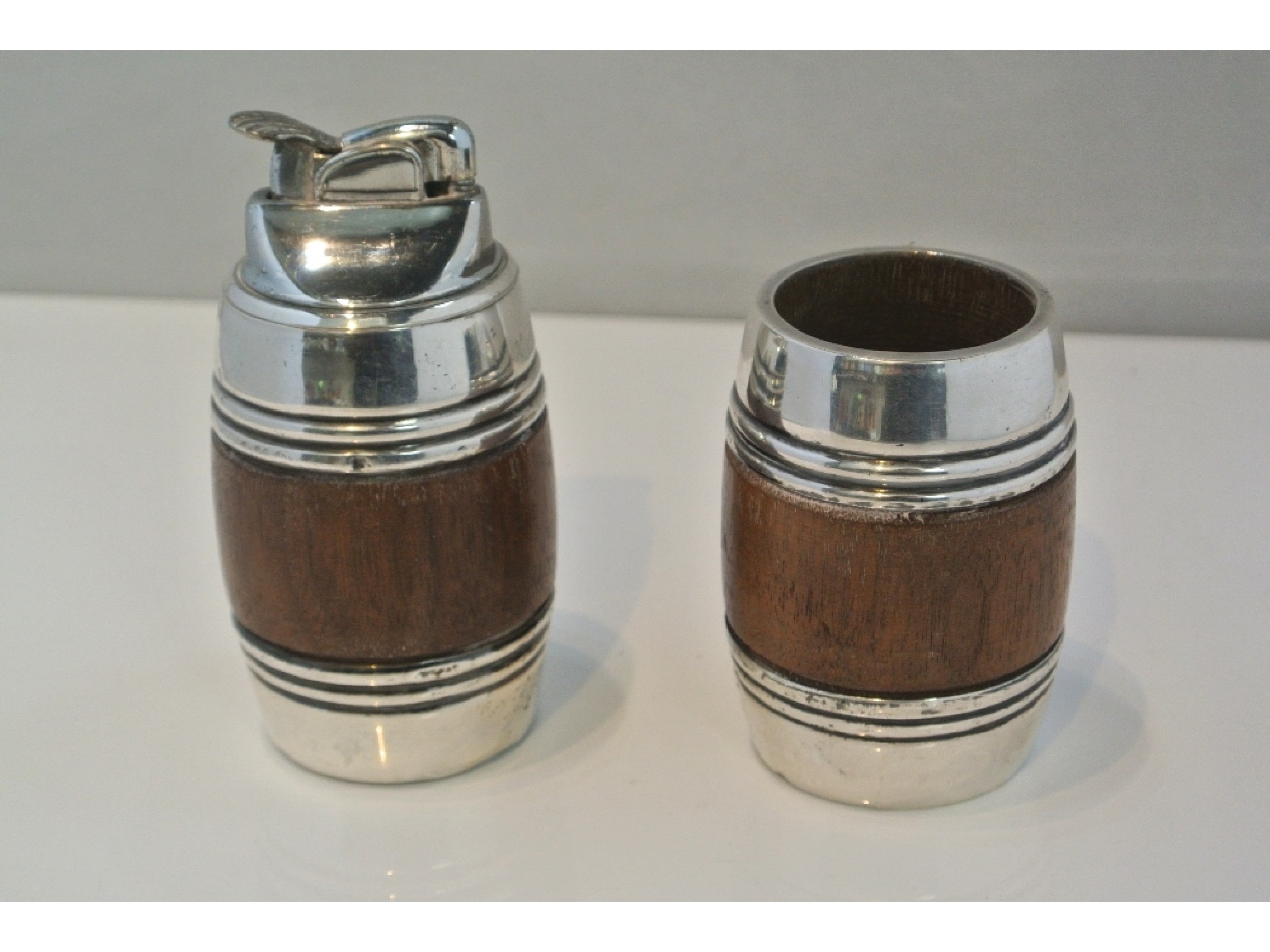 Appraisal: A matching barrel shaped cigarette holder and matching lighter the