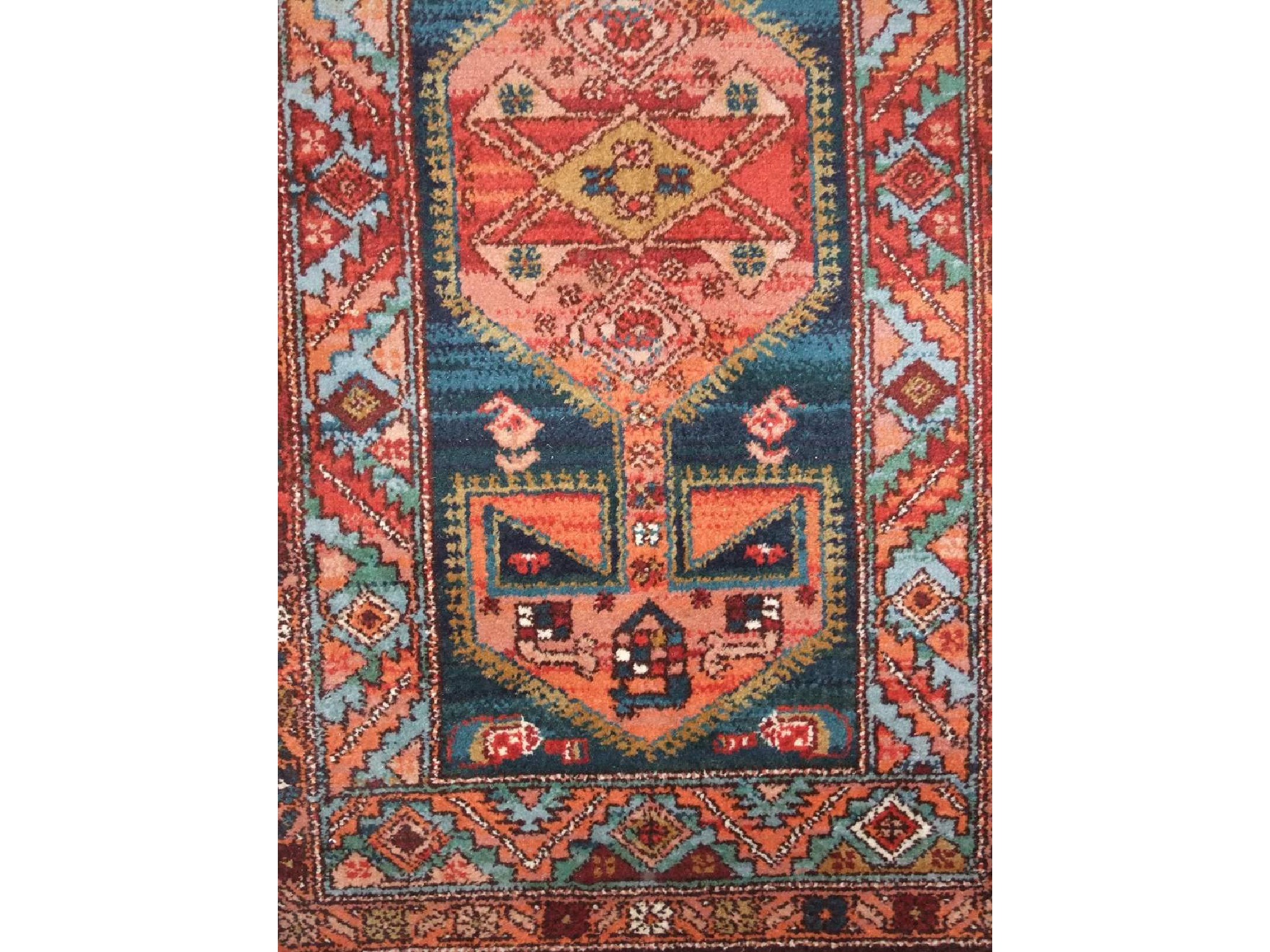 Appraisal: A Persian style wool rug with blue field geometric medallion