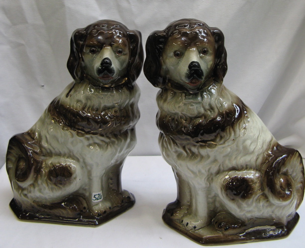 Appraisal: PAIR OF ENGLISH STAFFORDSHIRE FIGURAL SPANIELS brown accents on gray