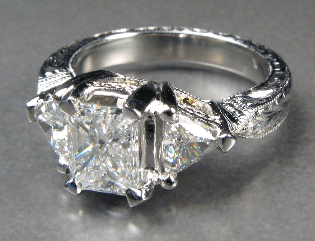 Appraisal: DIAMOND AND PLATINUM RING centering a rectangular princess-cut diamond weighing