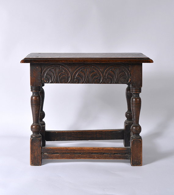 Appraisal: A carved oak coffin stool th Century style cm x