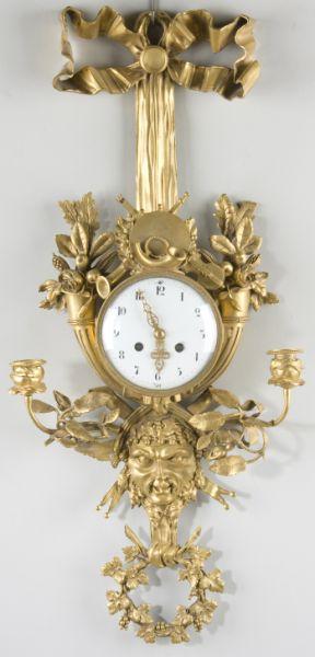 Appraisal: French Gilt Brass Cartel Clock with Two Sconces th century