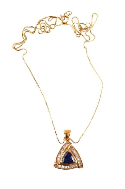 Appraisal: Triangular pendant with trillion sapphire surrounded by diamond baguettes k