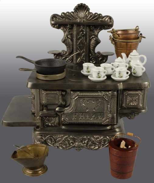 Appraisal: Cast Iron Stevens Prize Children's Stove Description Polished Includes accessories