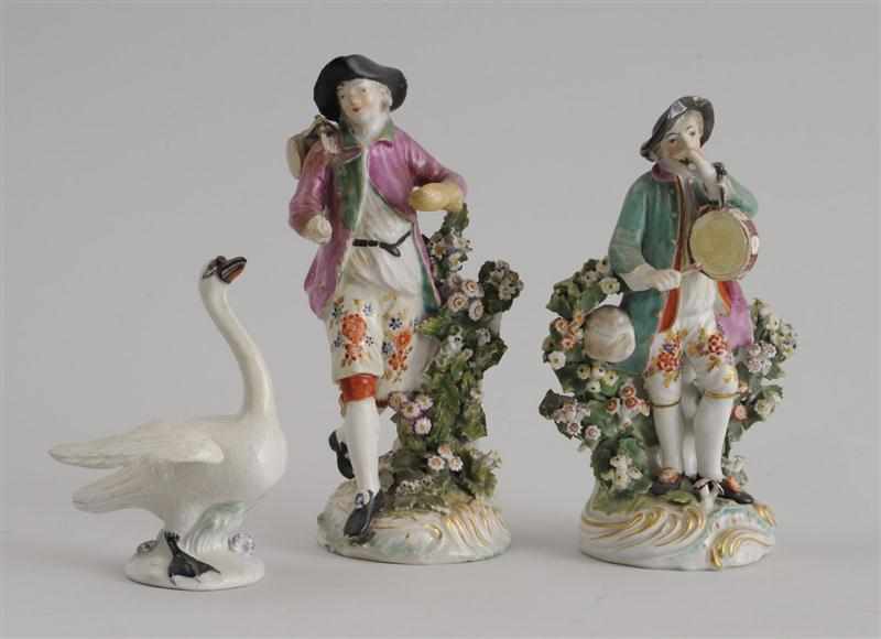 Appraisal: PAIR OF CHELSEA TYPE PORCELAIN FIGURES OF A YOUTH WITH