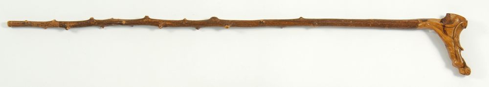 Appraisal: CARVED WOODEN CANE With handle in the form of a