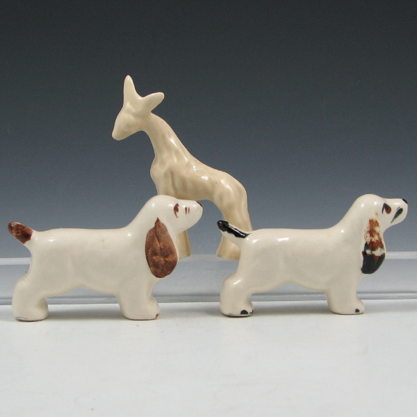 Appraisal: Small Pottery Spaniels Two Giraffe - Mint Lot of two