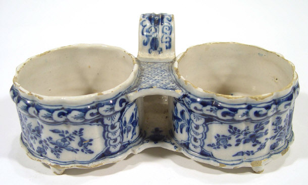 Appraisal: Continental Faience glazed two divisional cruet hand painted with blue