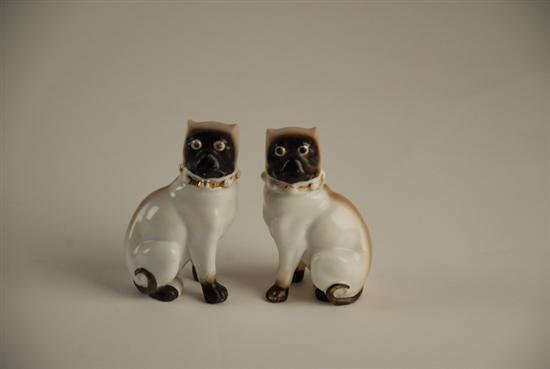 Appraisal: A Pair of Porcelain Pug Figures painted and gilt trimmed