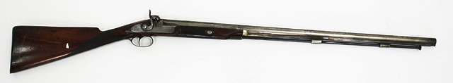 Appraisal: AN ANTIQUE PERCUSSION CAP RIFLE WITH OCTAGONAL TO ROUND BARREL