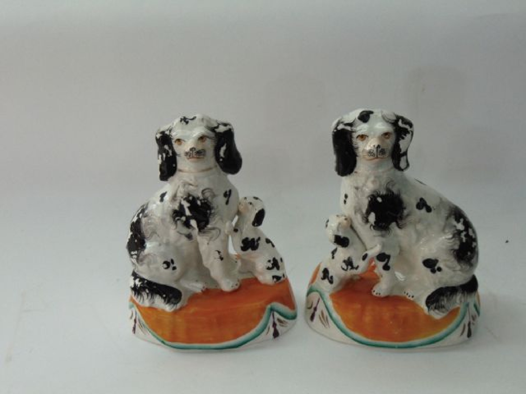 Appraisal: A pair of th century Staffordshire groups of black and