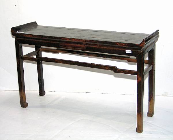 Appraisal: A mixed wood altar table With scrolled terminals to the